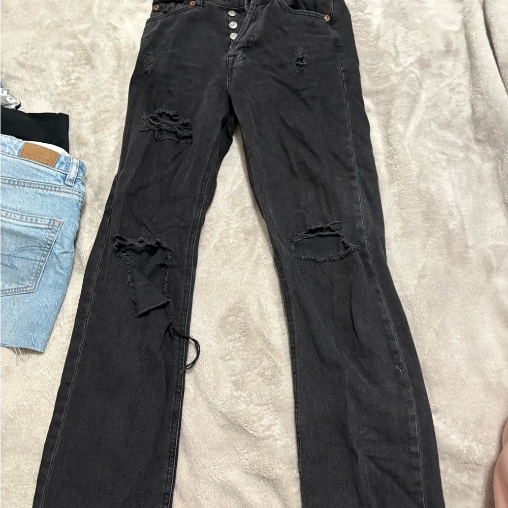 ripped black wide leg high rise jeans